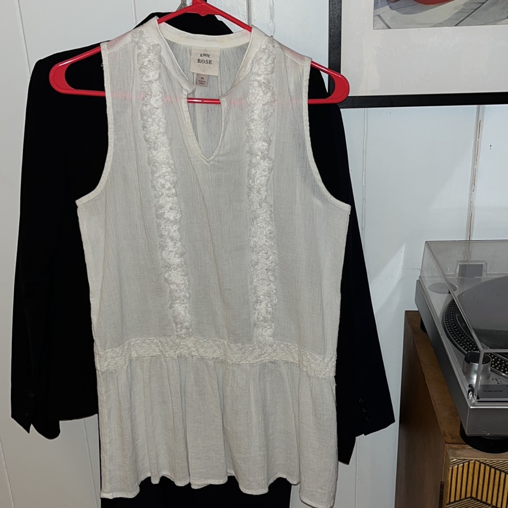 Sleeveless shirts. One Boho, One Catty